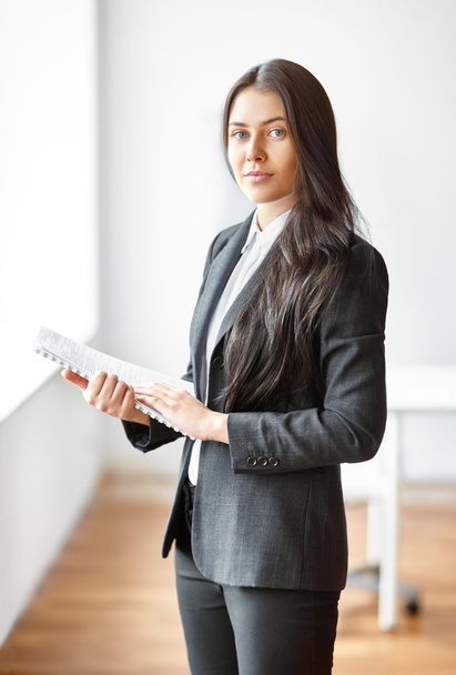 businesswoman with documents in office - Фото, зображення