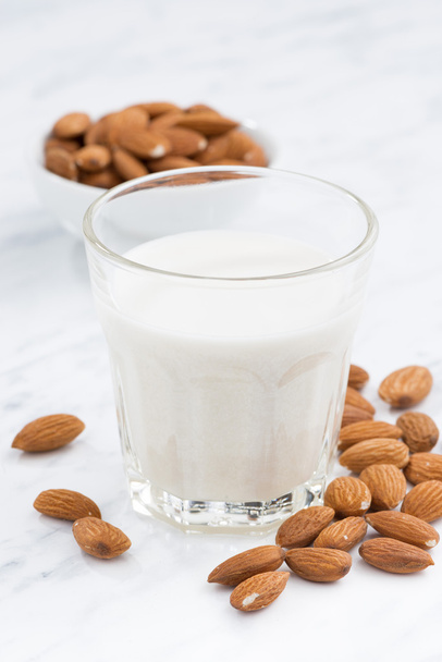 almond milk in a glass, closeup, vertical - Foto, Bild