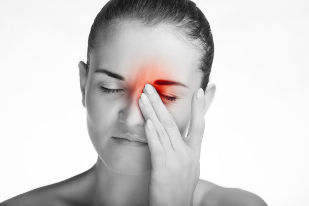 Woman has headache migraine or pain in eyes - Foto, afbeelding