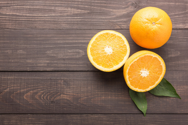 Fresh organic oranges fruits on wooden background - Фото, изображение