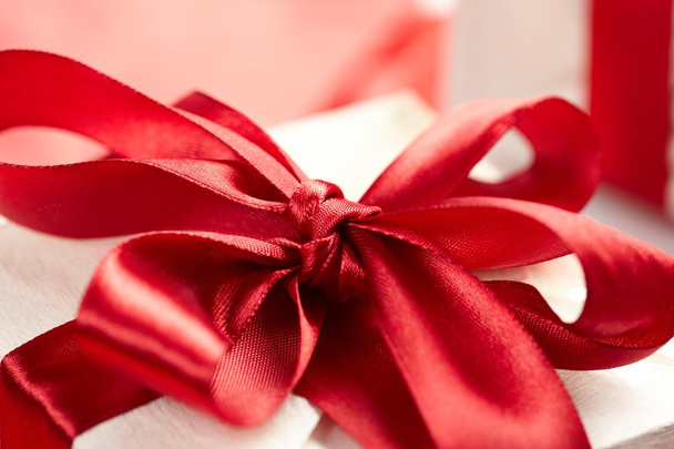 Beautiful gift box on the red background - Фото, зображення