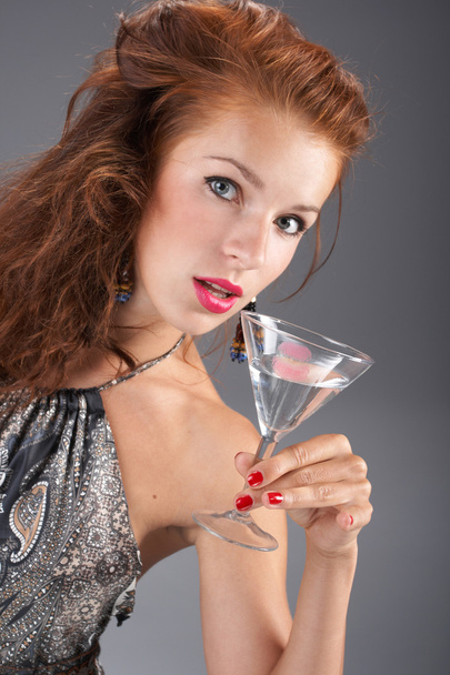 Beautiful woman with a cocktail - Фото, изображение