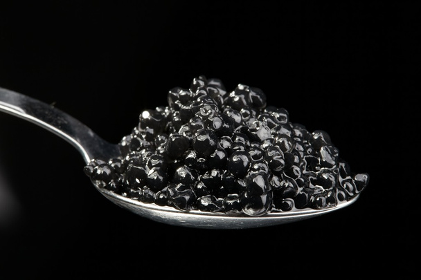 The full spoon of black caviar - Photo, Image