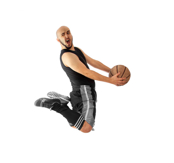 kosárlabda játékos ideiglenes tákolmány egy slam dunk egy fehér háttér - Fotó, kép