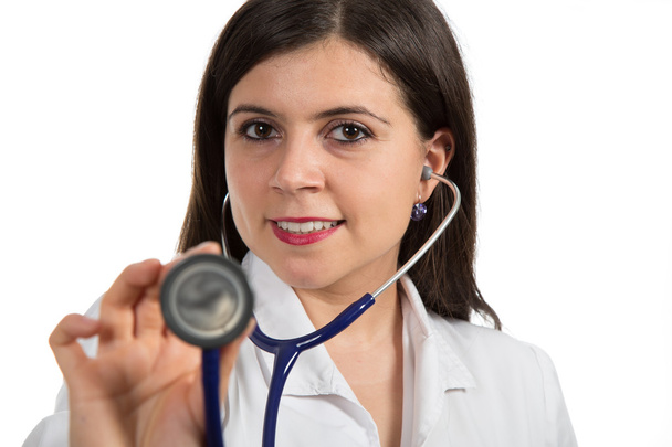Portrait of young female doctor holding stethoscope - Foto, imagen