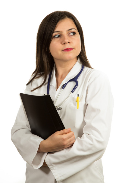 Portrait of young confident female doctor holding folder - Zdjęcie, obraz