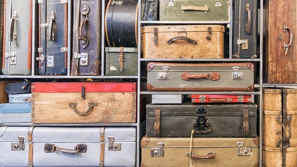 Pile of colorful vintage suitcases. - Fotó, kép