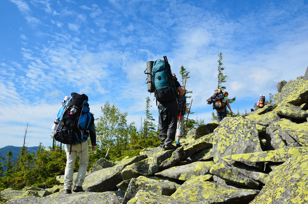 Hikers climbing up the mountain. - Photo, Image
