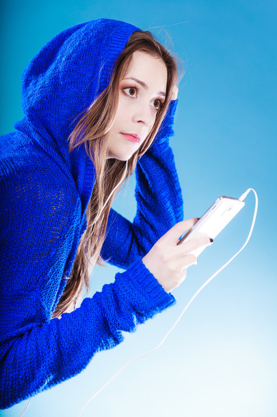 young woman with smart phone listening music - Photo, image
