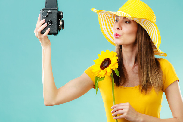 Summer woman holds sunflower old camera - Fotoğraf, Görsel