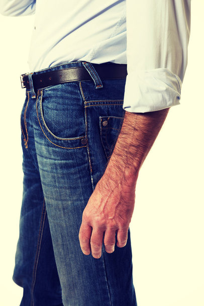 Side view of a men in jeans trousers - Фото, изображение