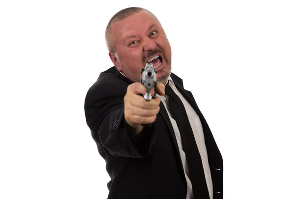 Homem de negócios de meia idade apontando arma
 - Foto, Imagem