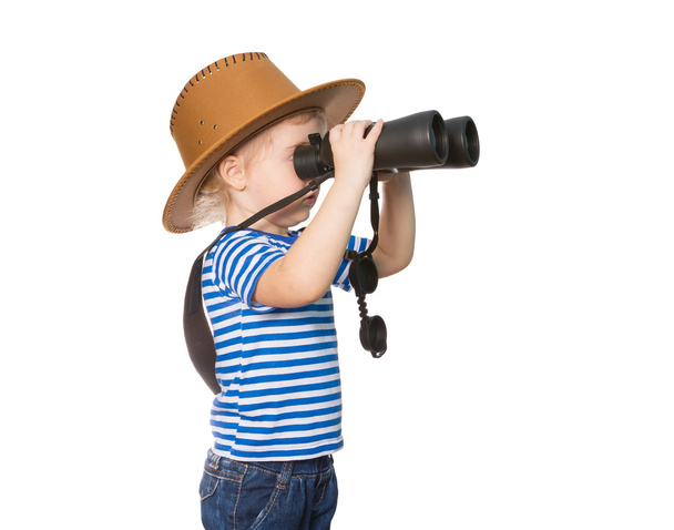Little Funny girl looking through binoculars. - Photo, Image