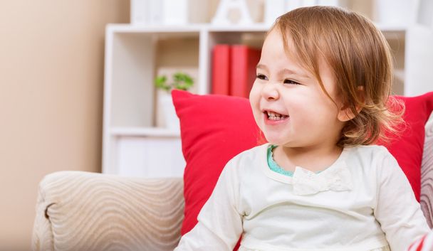 Happy toddler girl smiling in her house - Photo, Image