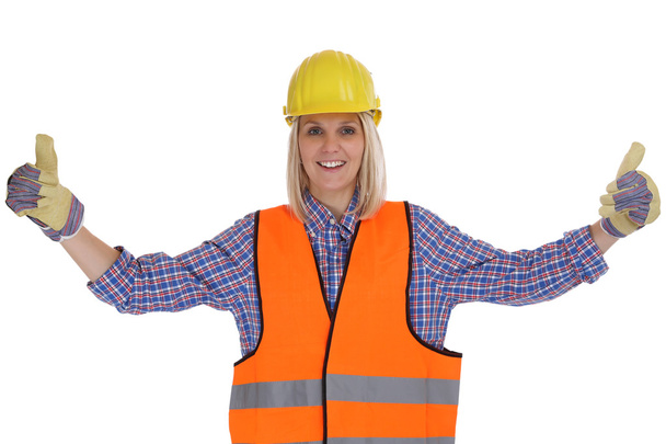 Young female construction worker woman occupation job thumbs up  - Фото, изображение