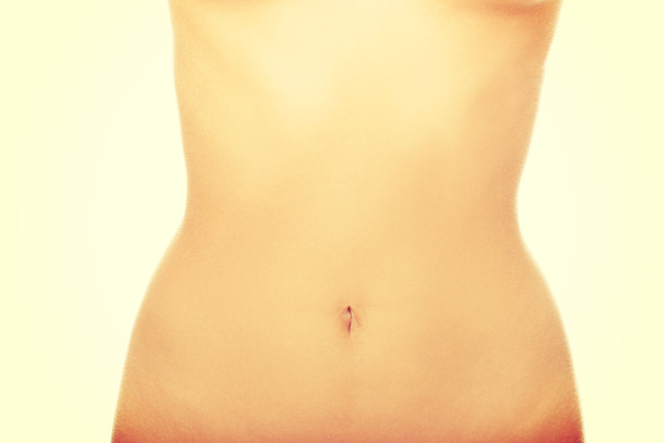 Womans slim belly. - 写真・画像