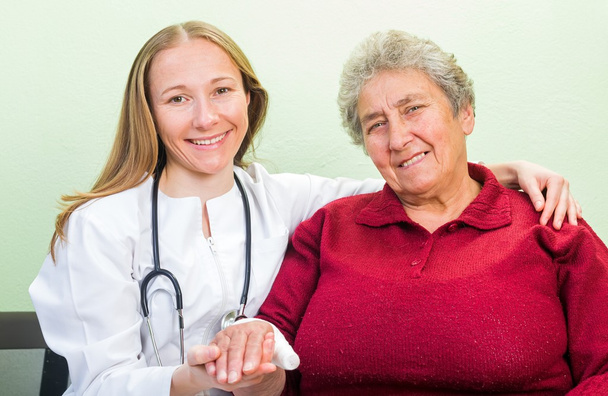 Elderly woman and young doctor - Photo, Image