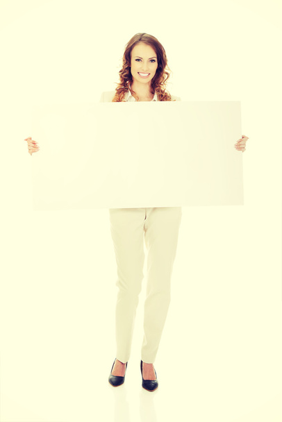 Business woman with empty banner. - Foto, Imagem