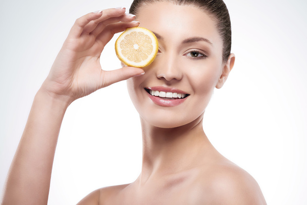 woman with slice of lemon - Photo, Image