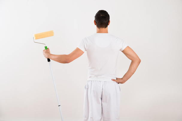Man Holding Paint Roller - Photo, image