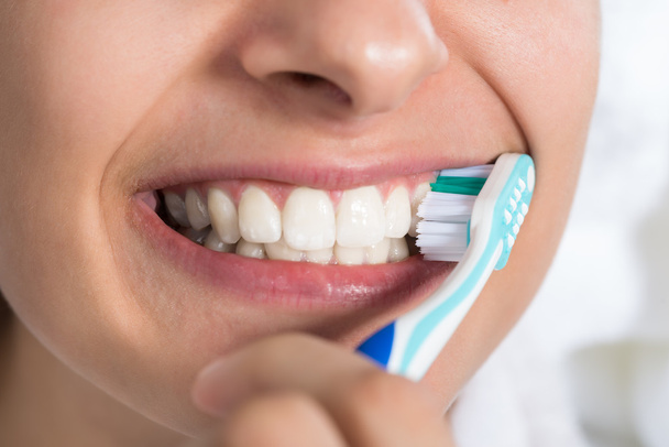 Woman Brushing Teeth At Home - Photo, Image