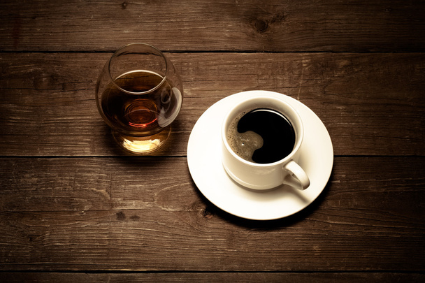 White cup of coffee and cognac in a glass on old wooden table. T - Foto, Imagen