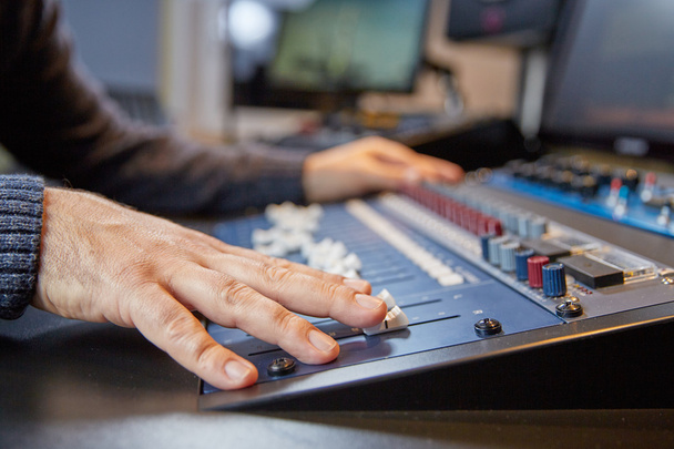 Hands of a man on adjusting a production console - Fotografie, Obrázek