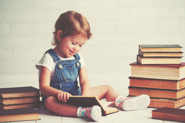 child little girl with books - Фото, изображение