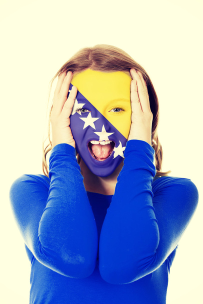 Bosnia and Herzegovina flag on womans face. - Foto, afbeelding
