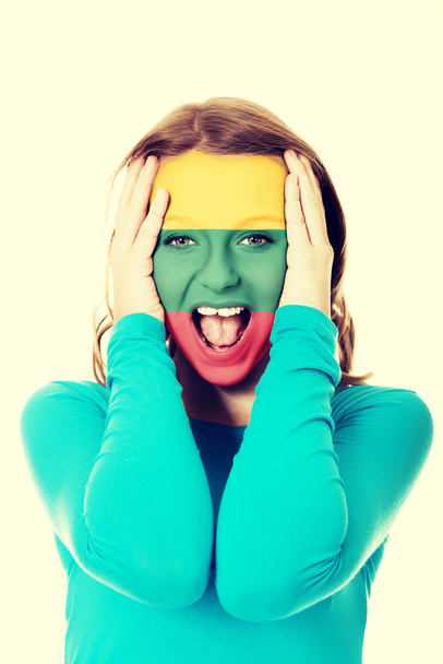 Woman with Lithuania flag on face. - Photo, Image