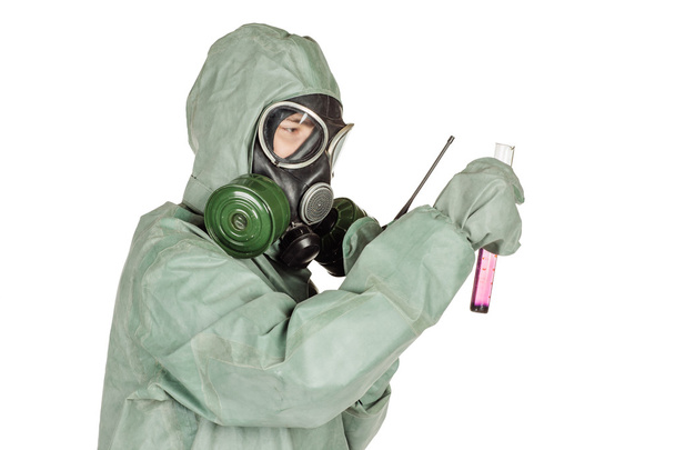 Man with protective mask and protective clothes examines a water sample - Foto, Imagen