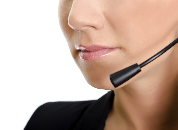 vrouwelijke klantenondersteuning operator met hoofdtelefoon. deel van gezicht. geïsoleerd op wit. - Foto, afbeelding