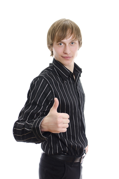 Casual young man showing thumb up and smiling. Isolated on white. - Valokuva, kuva