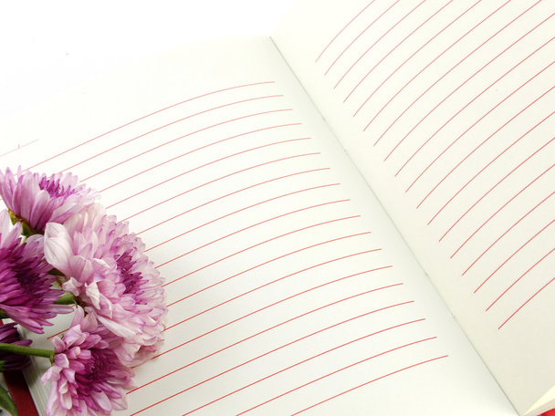 open notebook and beautiful chrysanthemums pink flowers bouquet - Фото, изображение