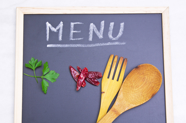 menu board with spoon and peppers - Fotó, kép