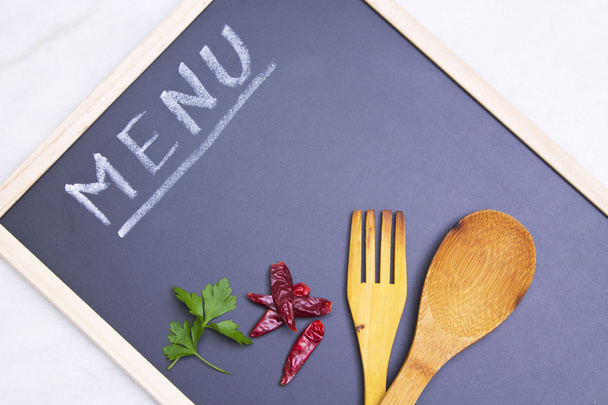 menu board with spoon and peppers - Фото, изображение