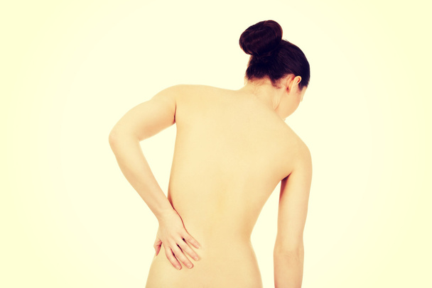 Женщина с болями в спине сзади
 - Фото, изображение