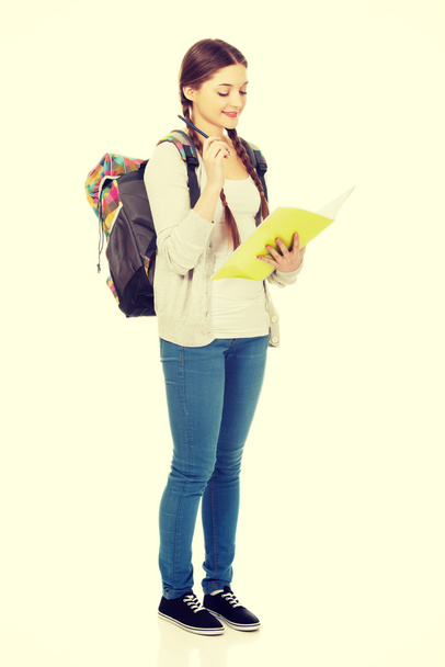 Thoughtful teenager with school backpack. - 写真・画像