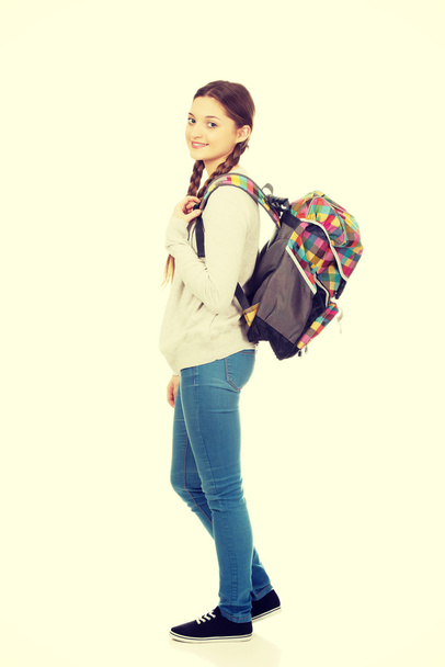 Happy teen woman with backpack. - Zdjęcie, obraz