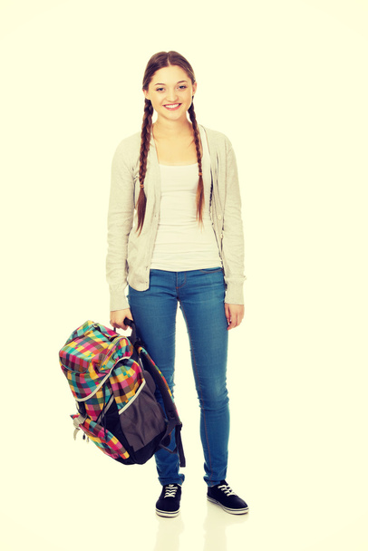 Happy teen woman with backpack. - Fotó, kép