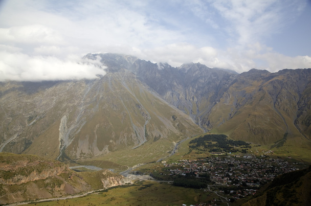 View of the mountain valley and settlement of Stepantsminda (Kazbegi). - Photo, Image