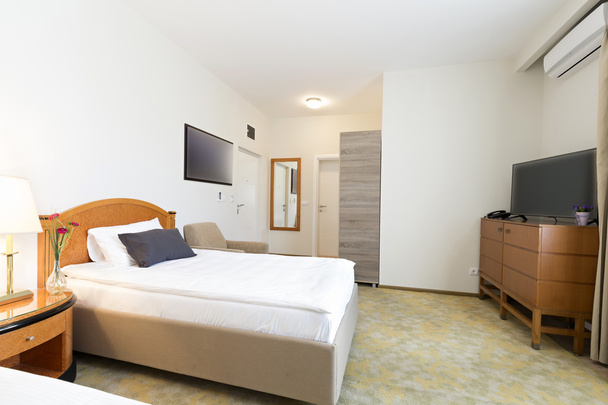 Interior of a double bed hotel room - Fotoğraf, Görsel