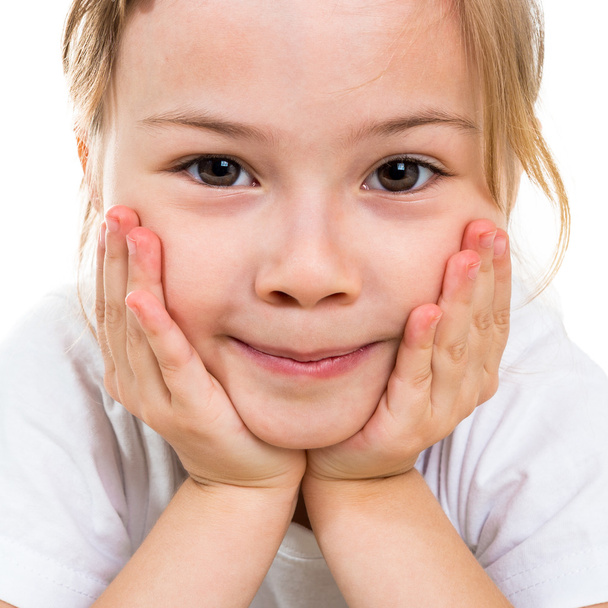 Portrait of a smiling little girl close-up - Fotó, kép