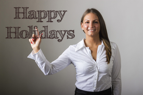 Happy Holidays - Beautiful girl touching text on transparent sur - Фото, изображение
