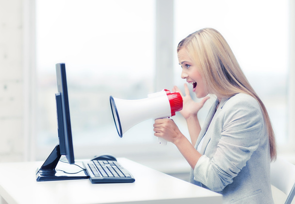 strict businesswoman shouting in megaphone - Photo, Image