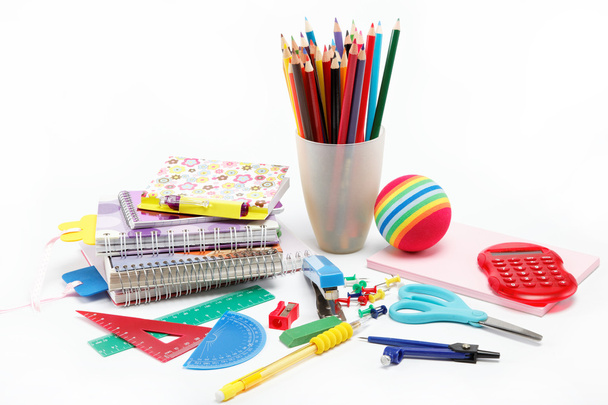 School supplies: notebook, pens, pencils on a white background. - Foto, afbeelding