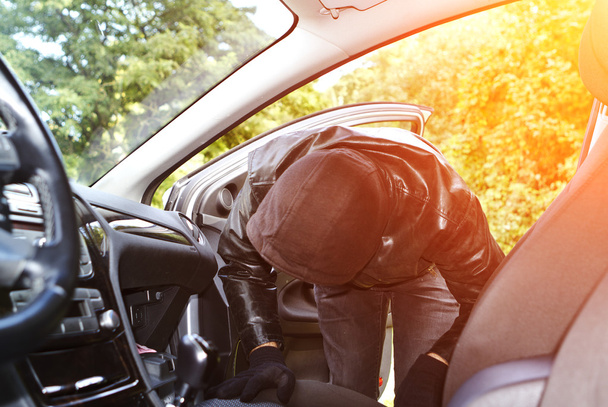 Thief stealing a car - Photo, image
