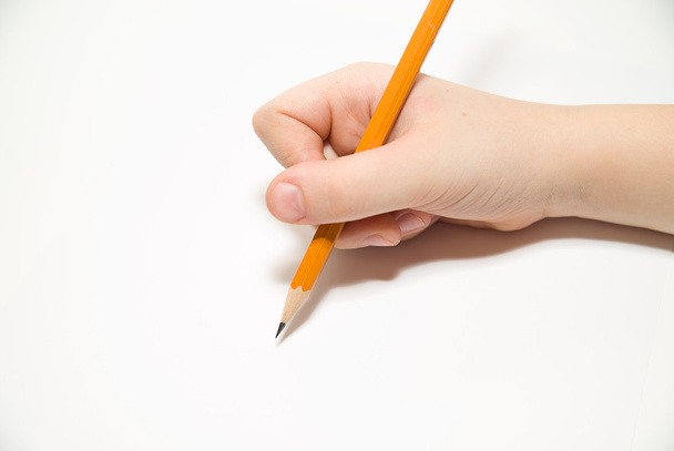 Gyerek rigth kezében egy ceruzát felett fehér - Fotó, kép
