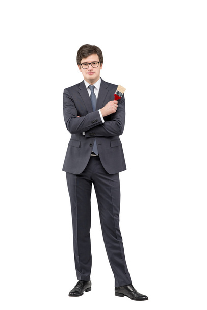 Young businessman with a brush - Foto, Bild