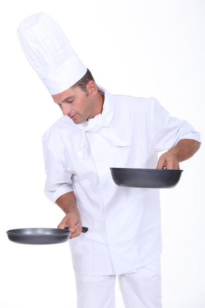 Chef holding two saucepans - Photo, Image